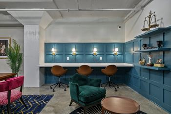 Modern workspace with teal cabinetry and built in desk